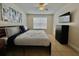 Spacious Primary bedroom with a king-size bed and large window at 2210 Grand Cayman Ct # 1722, Kissimmee, FL 34741