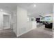 Loft area with carpet flooring, a half-wall, and a door at 9099 Hazard St, Davenport, FL 33896