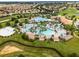 Aerial view of community pool, clubhouse, and surrounding homes at 9099 Hazard St, Davenport, FL 33896