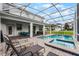 Enjoy the sun by the pool, spa, and patio furniture at 9099 Hazard St, Davenport, FL 33896
