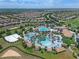 Large community pool and clubhouse with surrounding homes at 9099 Hazard St, Davenport, FL 33896