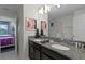 Double vanity bathroom with granite countertops and shower at 9099 Hazard St, Davenport, FL 33896
