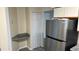 Kitchen area with stainless steel refrigerator and granite countertops at 3727 Lake Orlando Pkwy # 4, Orlando, FL 32809