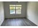 Bedroom with pool view, grey vinyl flooring and ceiling fan at 3727 Lake Orlando Pkwy # 4, Orlando, FL 32808