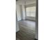 Dining room with chandelier, grey vinyl flooring and window with blinds at 3727 Lake Orlando Pkwy # 4, Orlando, FL 32808