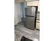 Kitchen with stainless steel refrigerator and granite countertops at 3727 Lake Orlando Pkwy # 4, Orlando, FL 32808