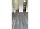 Bedroom with gray vinyl plank flooring and bathroom access at 3727 Lake Orlando Pkwy # 4, Orlando, FL 32808