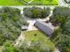 Single-story home with a circular driveway and lush landscaping at 6365 Whip O Will E Ln, St Cloud, FL 34771