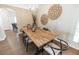 Long wooden dining table with black chairs in dining room at 1104 Bloomingdale Dr, Davenport, FL 33897