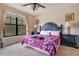 Spacious bedroom with king-size bed and large window at 901 Charo Pkwy # 721, Davenport, FL 33897