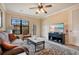 Comfortable living room with a couch and access to balcony at 901 Charo Pkwy # 721, Davenport, FL 33897