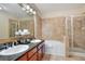 Double vanity bathroom with soaking tub and shower at 901 Charo Pkwy # 721, Davenport, FL 33897