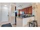 Modern kitchen with dark wood cabinets and breakfast bar at 901 Charo Pkwy # 721, Davenport, FL 33897