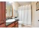 Clean bathroom with shower/tub combo and granite vanity at 901 Charo Pkwy # 721, Davenport, FL 33897