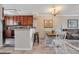 Open kitchen with dark wood cabinets and breakfast bar at 901 Charo Pkwy # 721, Davenport, FL 33897