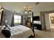 Bright bedroom with a king-size bed and ceiling fan at 2321 Hinsdale Dr, Kissimmee, FL 34741
