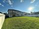 Large backyard with grassy area and a home in background at 2321 Hinsdale Dr, Kissimmee, FL 34741