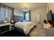 Main bedroom with king bed, stylish decor, and plenty of light at 2321 Hinsdale Dr, Kissimmee, FL 34741