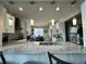 Open kitchen boasts granite island, breakfast nook, and pendant lighting at 2321 Hinsdale Dr, Kissimmee, FL 34741
