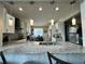 Open kitchen boasts granite island, breakfast nook, and pendant lighting at 2321 Hinsdale Dr, Kissimmee, FL 34741
