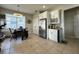 Modern kitchen with white cabinets, stainless steel appliances, and breakfast nook at 2321 Hinsdale Dr, Kissimmee, FL 34741