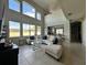 Large living room with a curved sectional sofa, high ceilings, and large windows at 2321 Hinsdale Dr, Kissimmee, FL 34741