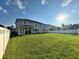 Large backyard with grassy area and white fence at 2321 Hinsdale Dr, Kissimmee, FL 34741