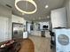 Modern kitchen with white cabinets, stainless steel appliances, and breakfast nook at 2321 Hinsdale Dr, Kissimmee, FL 34741