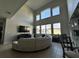 Large living room with a curved sectional sofa and high ceilings at 2321 Hinsdale Dr, Kissimmee, FL 34741