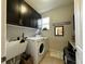 Laundry room with washer, dryer, and extra storage at 2321 Hinsdale Dr, Kissimmee, FL 34741