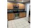 Modern kitchen with stainless steel appliances and ample counter space at 1034 Chalcedony St, Kissimmee, FL 34744