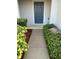 Welcoming front entry with walkway and landscaping at 1034 Chalcedony St, Kissimmee, FL 34744