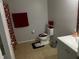 Clean bathroom with a toilet, sink, and shower/tub at 1034 Chalcedony St, Kissimmee, FL 34744