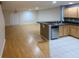 Open kitchen with stainless steel appliances and light wood cabinets at 1034 Chalcedony St, Kissimmee, FL 34744