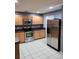 Well-equipped kitchen with stainless steel fridge at 1034 Chalcedony St, Kissimmee, FL 34744
