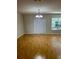 Bright dining room featuring hardwood floors and a chandelier at 1034 Chalcedony St, Kissimmee, FL 34744