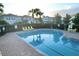 Relaxing community pool with lounge chairs at 1034 Chalcedony St, Kissimmee, FL 34744