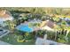 Community pool with a pool house and surrounding landscape at 1034 Chalcedony St, Kissimmee, FL 34744
