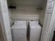 Convenient laundry room with washer, dryer, and shelving at 1034 Chalcedony St, Kissimmee, FL 34744