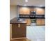 Modern kitchen with stainless steel appliances at 1034 Chalcedony St, Kissimmee, FL 34744