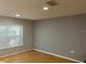 Spacious living room with hardwood floors and neutral walls at 1034 Chalcedony St, Kissimmee, FL 34744