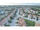 Aerial view of a community featuring multiple houses, roads, and green spaces at 1034 Chalcedony St, Kissimmee, FL 34744