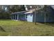 Newly built light blue house with covered patio, spacious backyard and side yard at 106 Sparrow Ct, Kissimmee, FL 34759