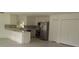 Kitchen with white cabinets and stainless steel appliances at 106 Sparrow Ct, Kissimmee, FL 34759