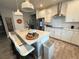 Modern kitchen island with quartz countertop and breakfast bar seating at 5652 Arborvista Dr, Saint Cloud, FL 34771