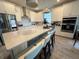 Modern kitchen with white cabinets, stainless steel appliances, and quartz countertops at 5652 Arborvista Dr, Saint Cloud, FL 34771