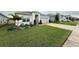 House exterior with well-manicured lawn at 5652 Arborvista Dr, Saint Cloud, FL 34771