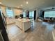 Modern kitchen with island and open floor plan at 5652 Arborvista Dr, Saint Cloud, FL 34771