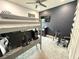 Bedroom with bunk bed, gaming setup, and dark accent wall at 5652 Arborvista Dr, Saint Cloud, FL 34771
