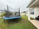 Spacious backyard with trampoline and covered patio at 5652 Arborvista Dr, Saint Cloud, FL 34771